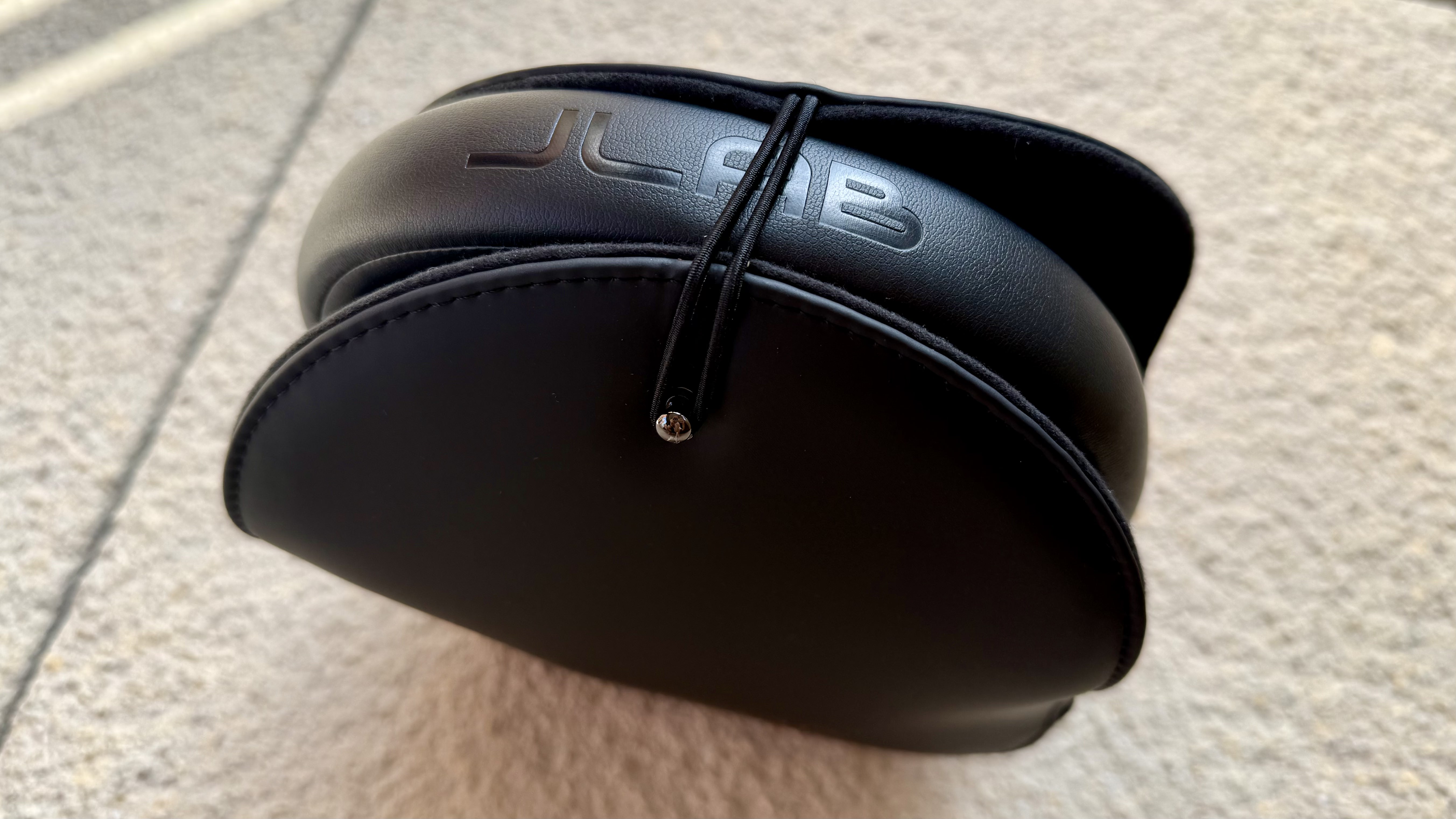 The jlab jbuds open wireless headphones pictured in their carry case