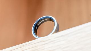 Samsung Galaxy Ring in silver showing the Samsung brand along the interior