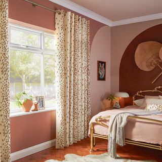 Light full length curtains in a dark bedroom room scheme