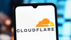 The Cloudflare logo shown on a phone.