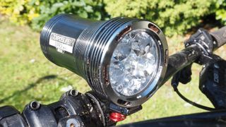 An Exposure Six Pack front light fitted to an MTB handlebar