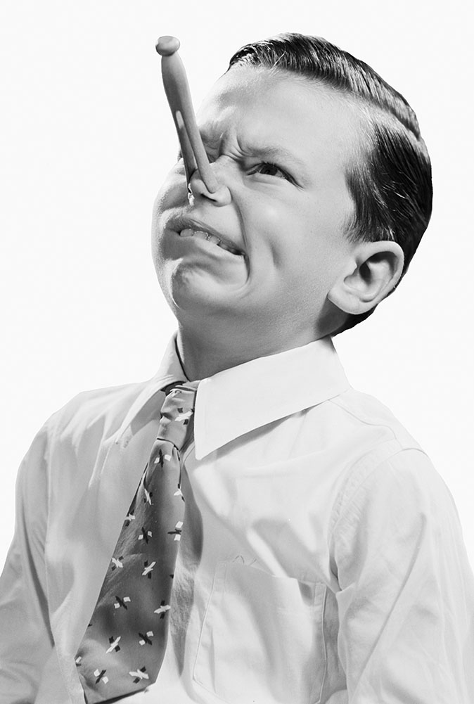 Stuffed nose: boy with clothespeg on his nose