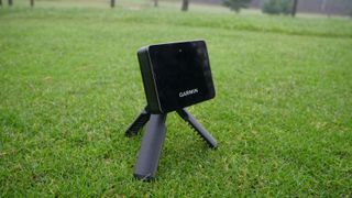 Garmin Approach R10 Launch Monitor resting on the golf course