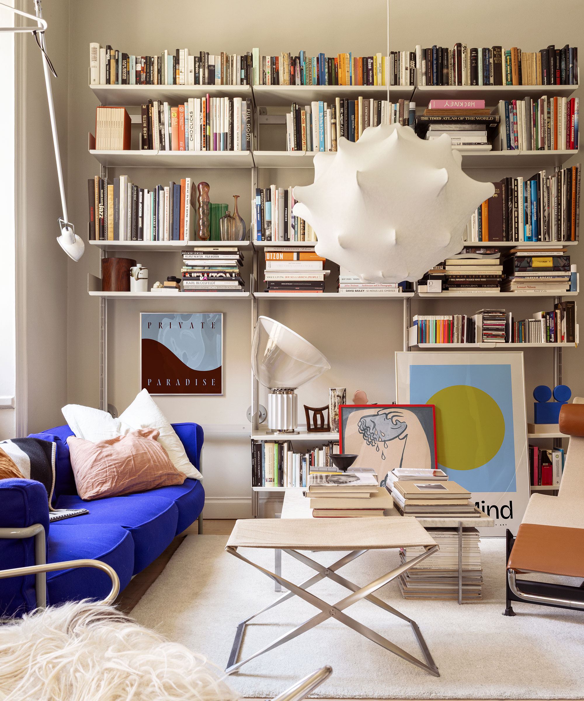 library with bookshelves and oversized statement light