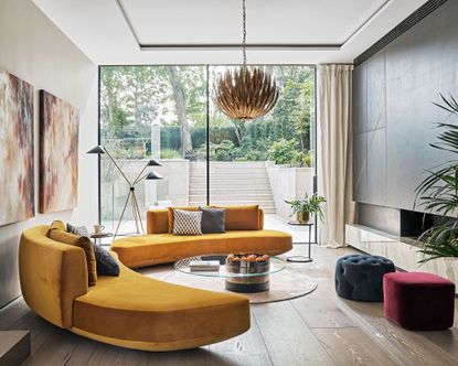 Living room with orange curved sofa
