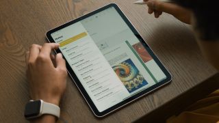iPadOS 17's PDF app on an iPad placed on a wooden surface.