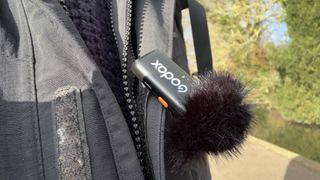 Godox WEC microphone attached to a jacket lapel