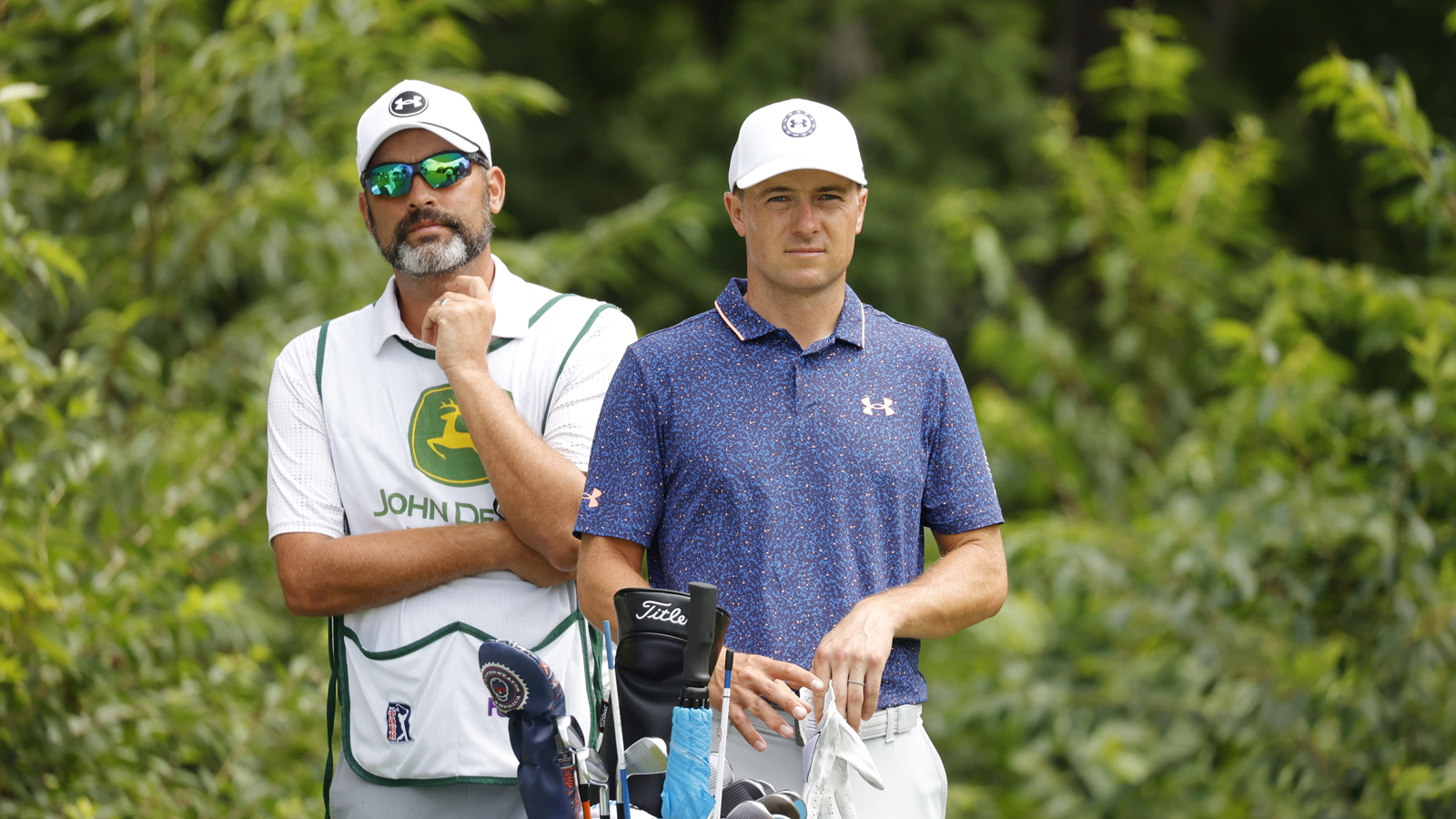 Jordan Spieth and his caddie chat about a shot