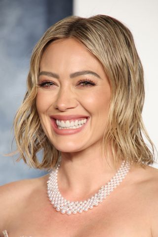 Hilary Duff with her bobbed hair in a wet look style.