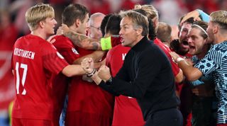 layers of Denmark and Kasper Hjulmand, Head Coach of Denmark, celebrate after Pierre-Emile Hoejbjerg scored the team's first goal during the UEFA EURO 2024 European qualifier match between Finland and Denmark at Helsinki Olympic Stadium on September 10, 2023 in Helsinki, Finland.