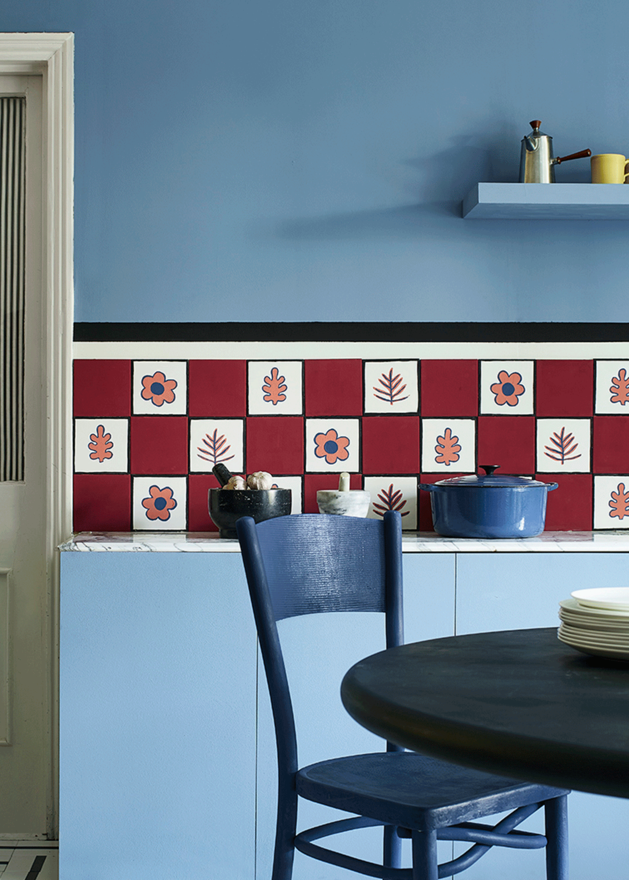 Kitchen with painted tile floor by Annie Sloan