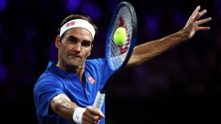 Roger Federer of Team Europe plays a backhand in his singles match against John Isner of Team World during Day Three of the Laver Cup.