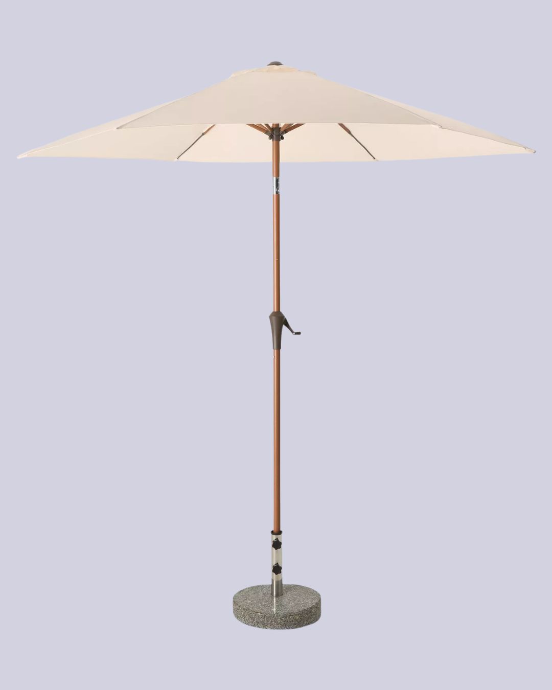 A beige parasol with wood and stone base against a pale lilac background.