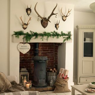 room with white wall and deer horns