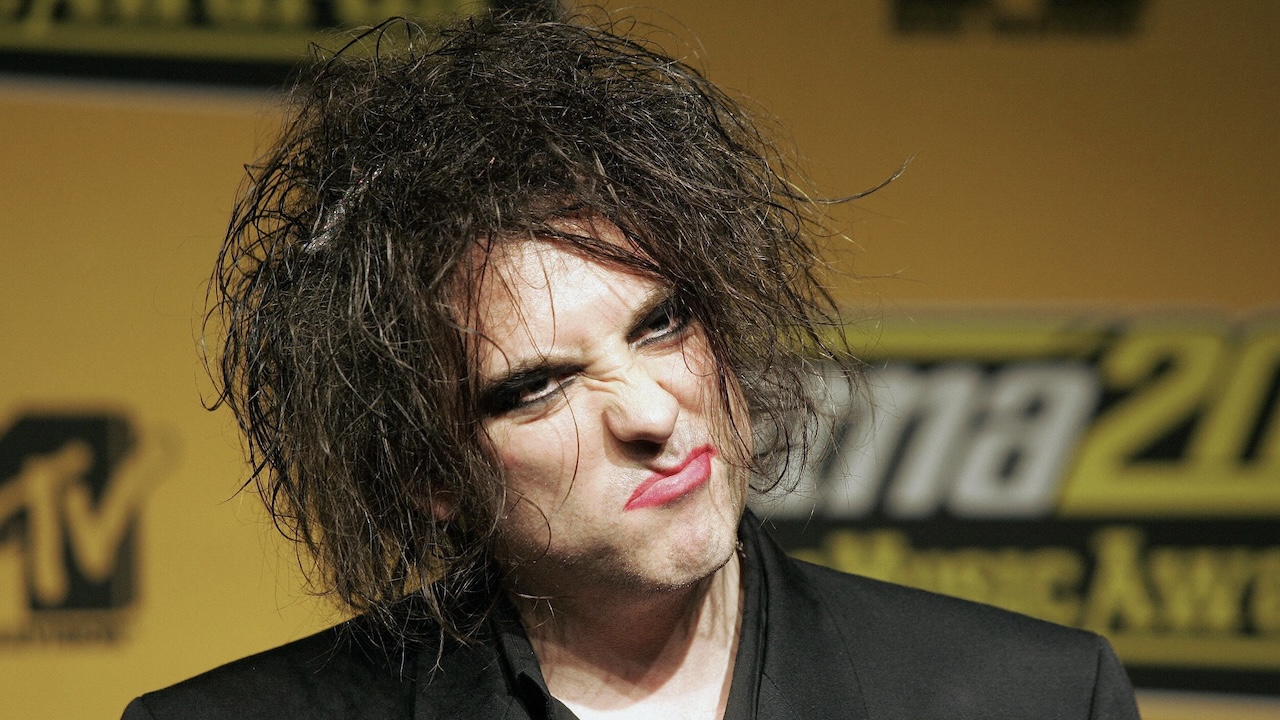Robert Smith of The Cure grimaces during a photo call at the 2004 MTV Europe Music Awards