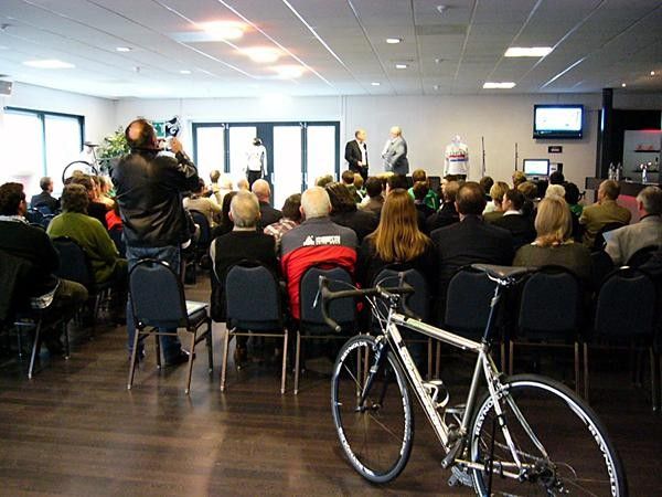The assembled guests and media listen to DFL managing director, Nick Collins, be interviewed at the launch of the launch of the DFL-Cyclingnews-Litespeed squad.