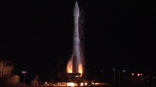 The United Launch Alliance Atlas V rocket carrying the NROL-55 spy satellite and 13 cubesats ignites its engines for a smooth Oct. 8 launch into space from California's Vandenberg Air Force Base.