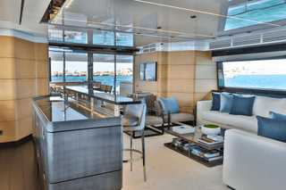 The interior of a sleek kitchen on a superyacht with audio solutions from Genelec.