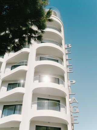 The design is retro and modern - here we see the bright white curved facade. Skies are ultra blue
