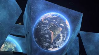 The planet Earth projected onto an angled screen at the BBC immersive experience.