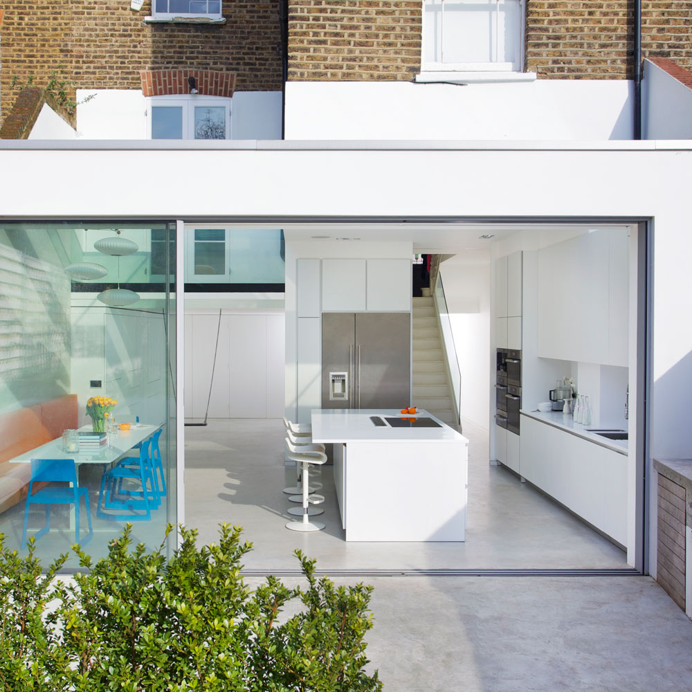 patio area with white kitchen