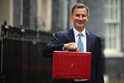 Jeremy Hunt holding budget box