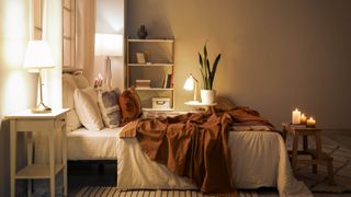 A bedroom with beige and white tones