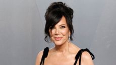 kris jenner on a gray background