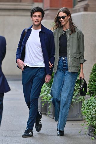 Karlie Kloss wears a green army jacket in NYC.