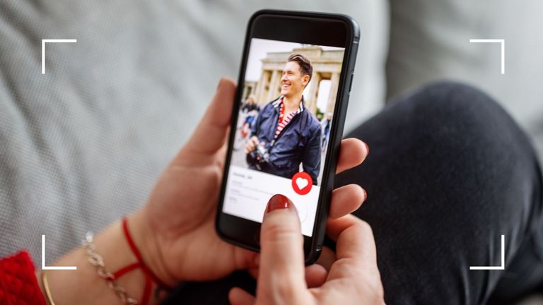 Woman using one of the best sex apps, Tinder, on mobile phone with painted red nails