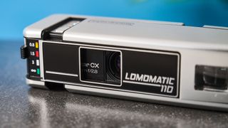 A gray Lomography Lomomatic 110 film camera in the metal variant