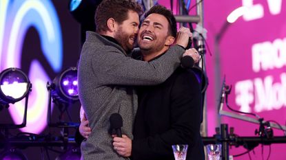 Jaymes Vaughan (L) and Jonathan Bennett speak onstage during the Times Square New Year's Eve 2022 Celebration on December 31, 2021 in New York City