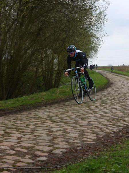 Team Sky's Chris Sutton gets acquainted with the cobbles.