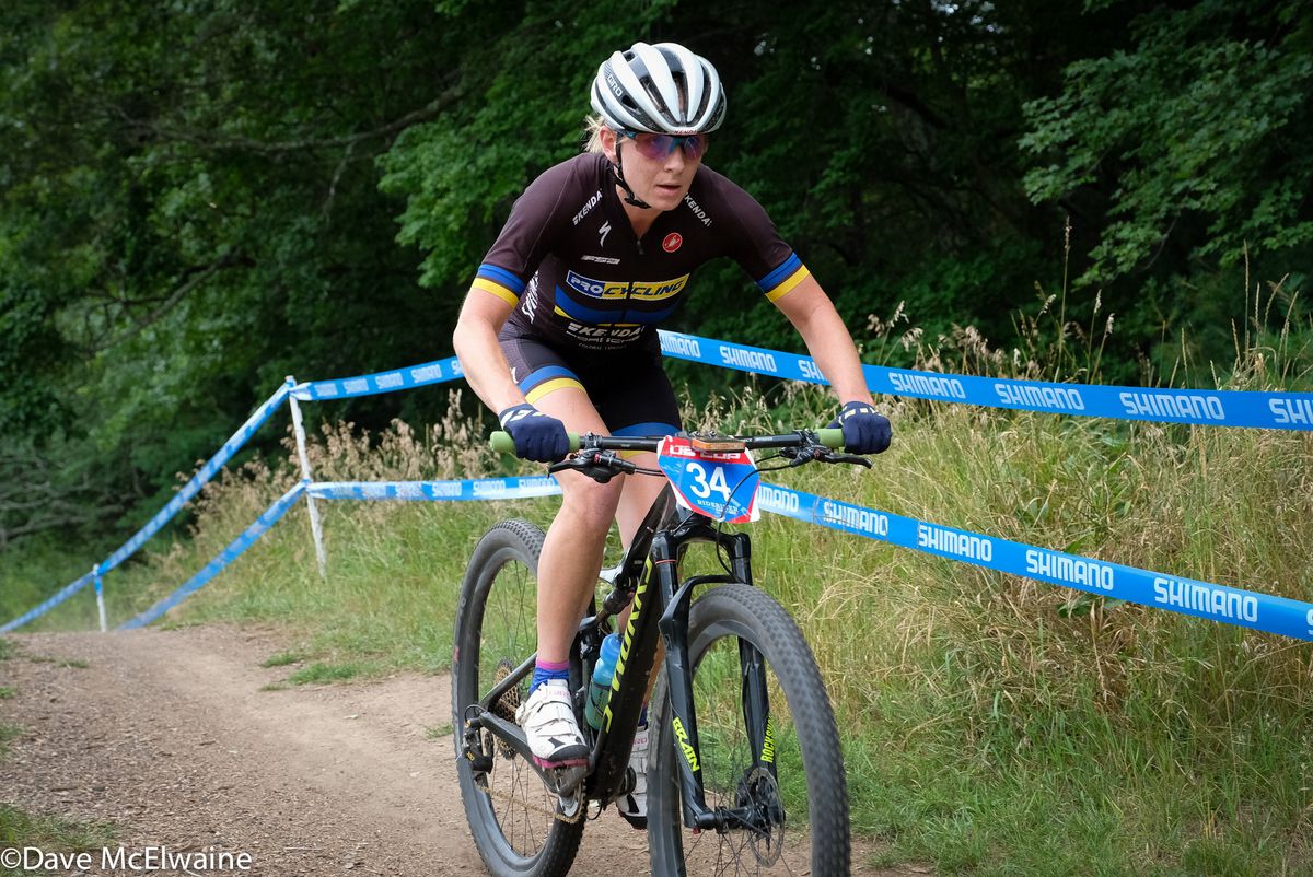 Amy Beisel (Pro Cycling) riding the home stretch at the end of lap five