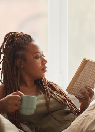 Woman reading in bed