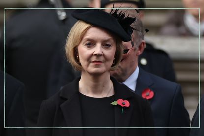 A close up of Liz Truss wearing black and a red poppy on Remembrance Day