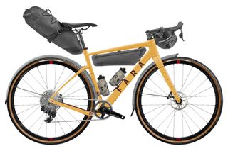 A yellow Fara bike with a bespoke build, with luggage and mudgards on