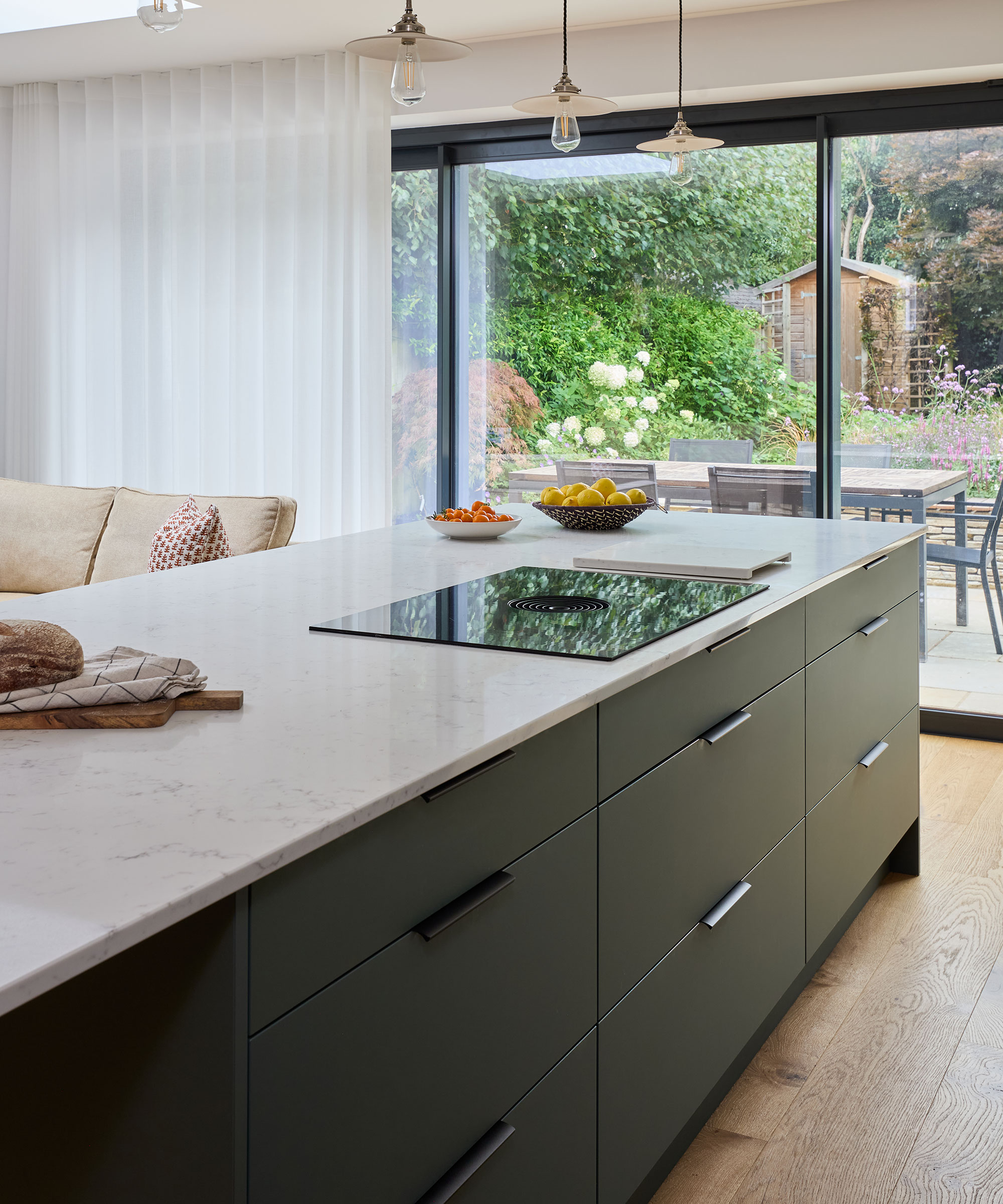 black modern flush fronted kitchen with marble worktop