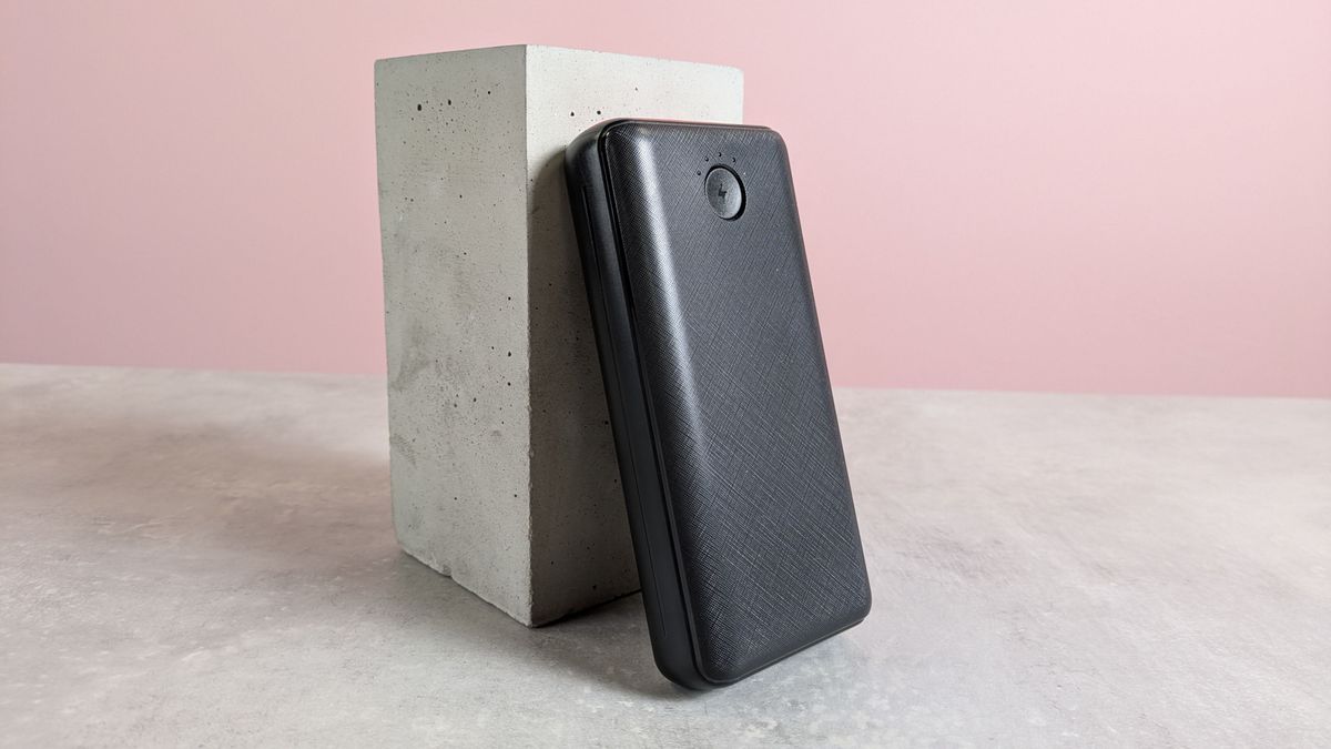 Jiga 27000mAh Power Bank leaning on plinth on pink background