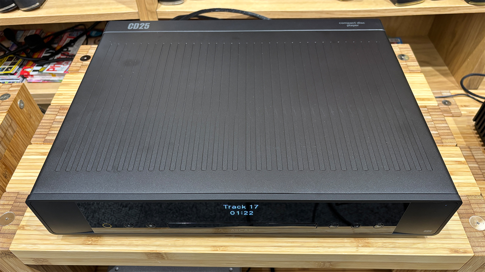 Arcam CD25 CD player on wooden hi-fi rack viewed from above