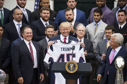 A personalized Super Bowl jersey and ring