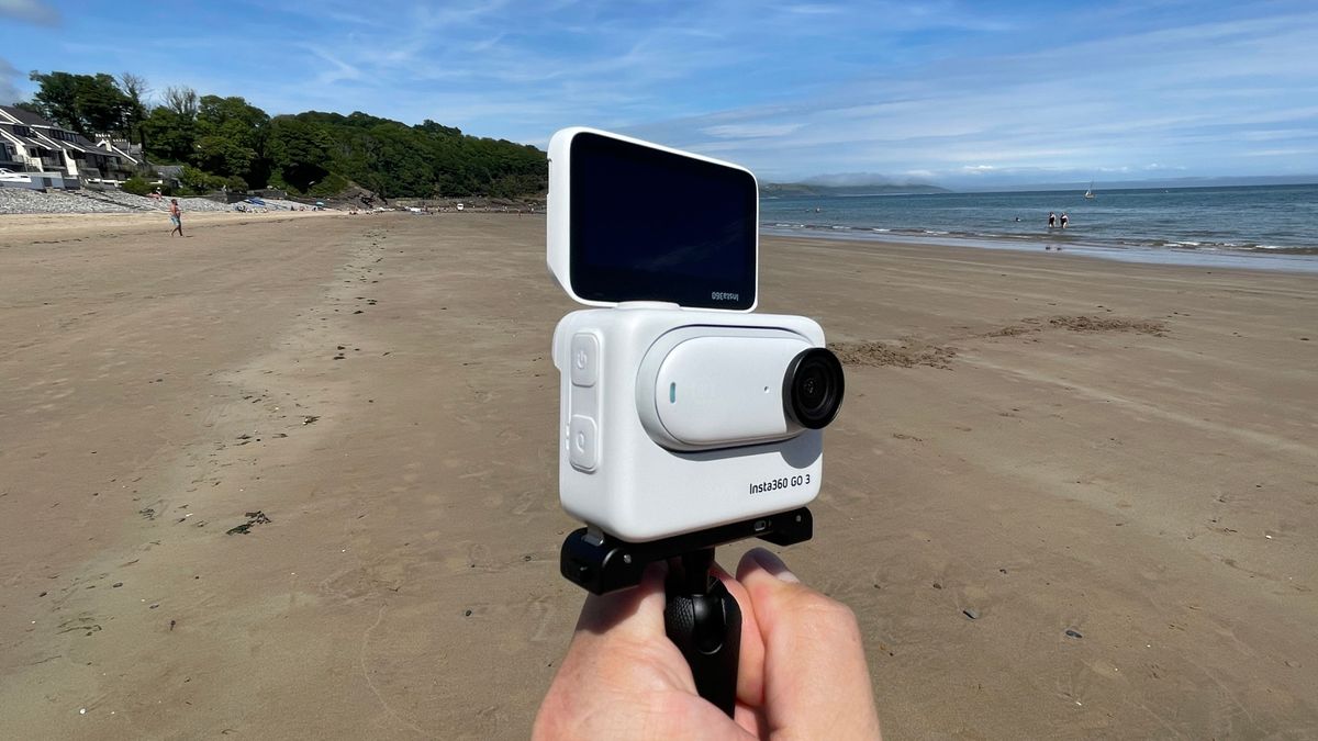 Insta360 GO 3 action camera on a beach