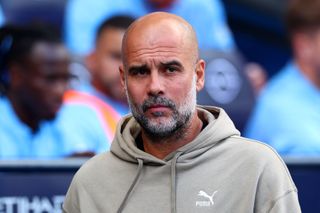 Manchester City boss Pep Guardiola in the Premier League looks on during a game