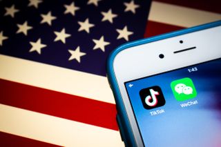 WeChat and TikTok logos with American flag background
