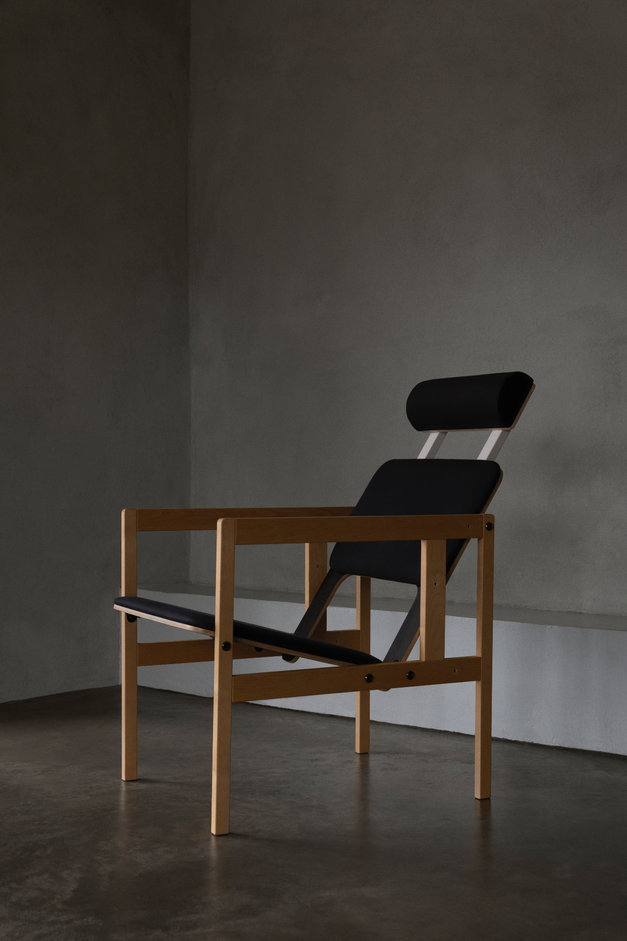 Wooden armchair with headrest