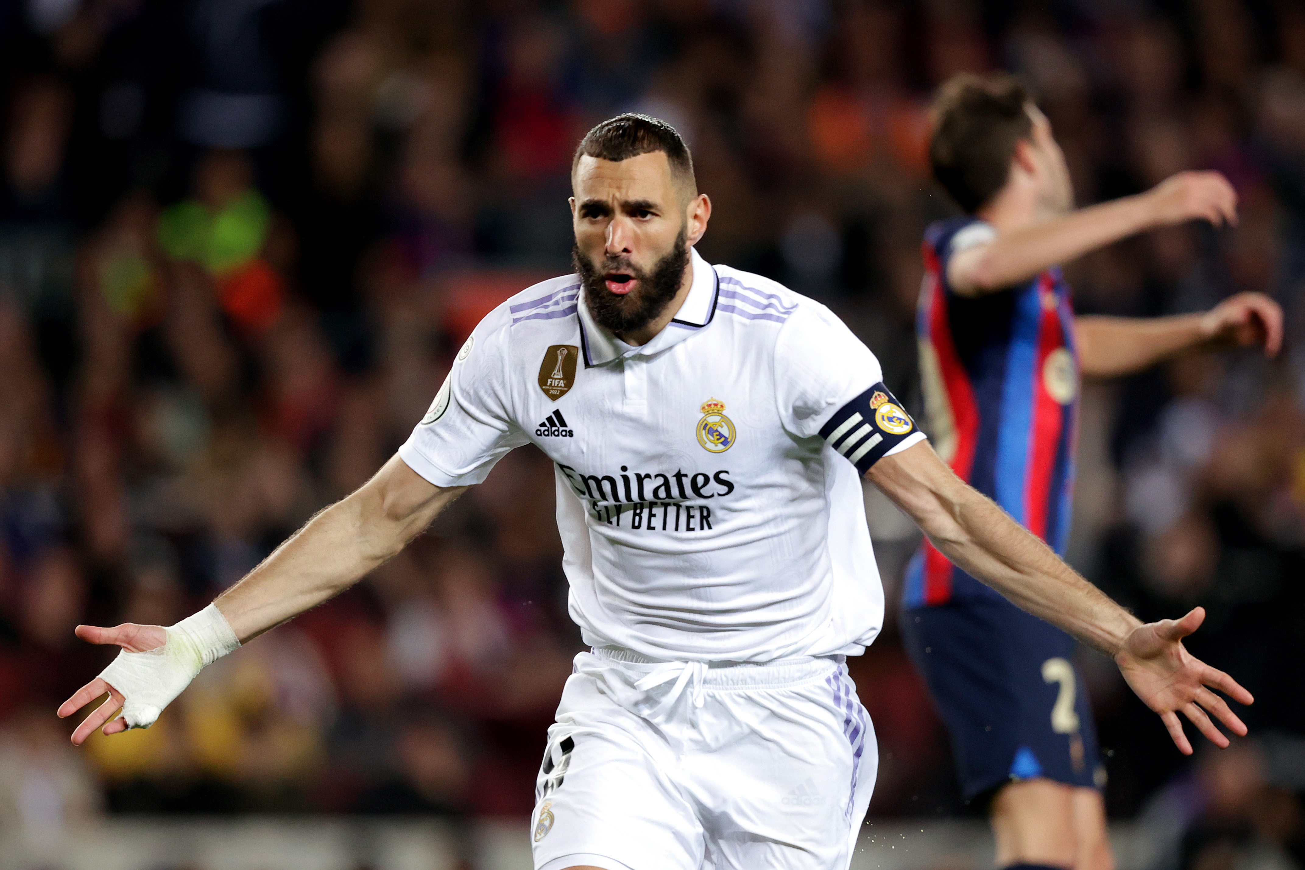 Karim Benzema celebrates his third goal for Real Madrid against Barcelona at Camp Nou in April 2023.