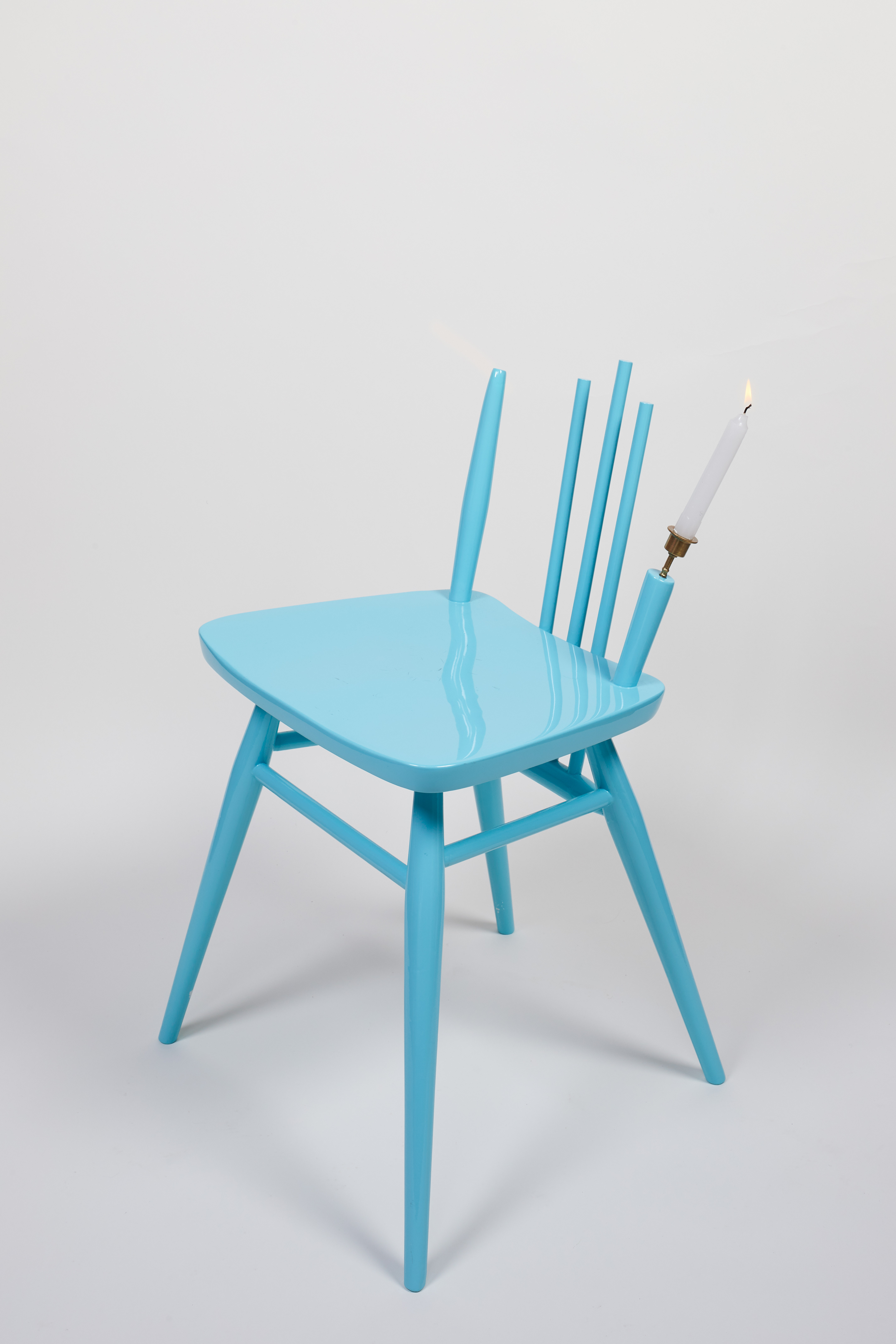 Sky blue chair with a lights set in an upright of the backrest