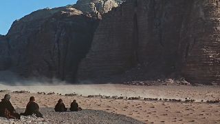 A vista of the desert with some mountains in the background in Lawrence Of Arabia