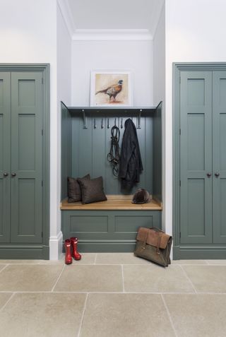 bootroom with blue green toned storage by lewis alderson