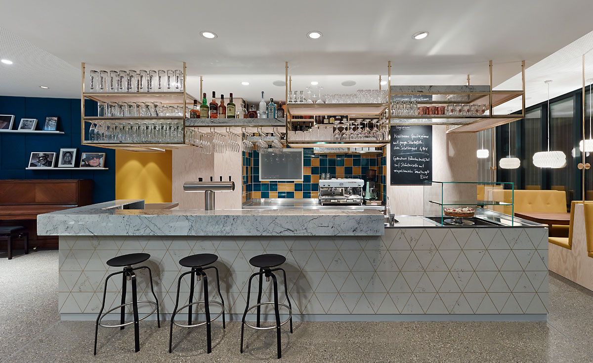 Bar counter with stools, overhead canopy cabinets , cake display rack